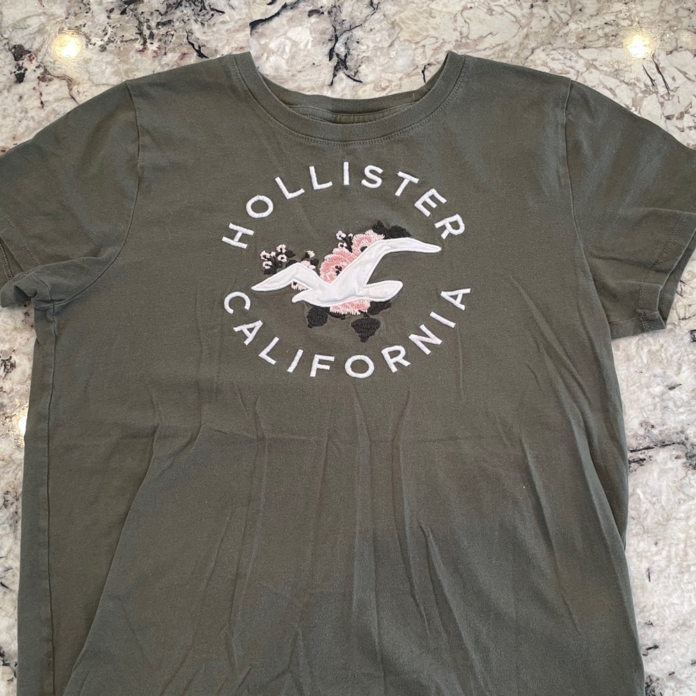 Women’s Hollister olive green tee. Size medium.